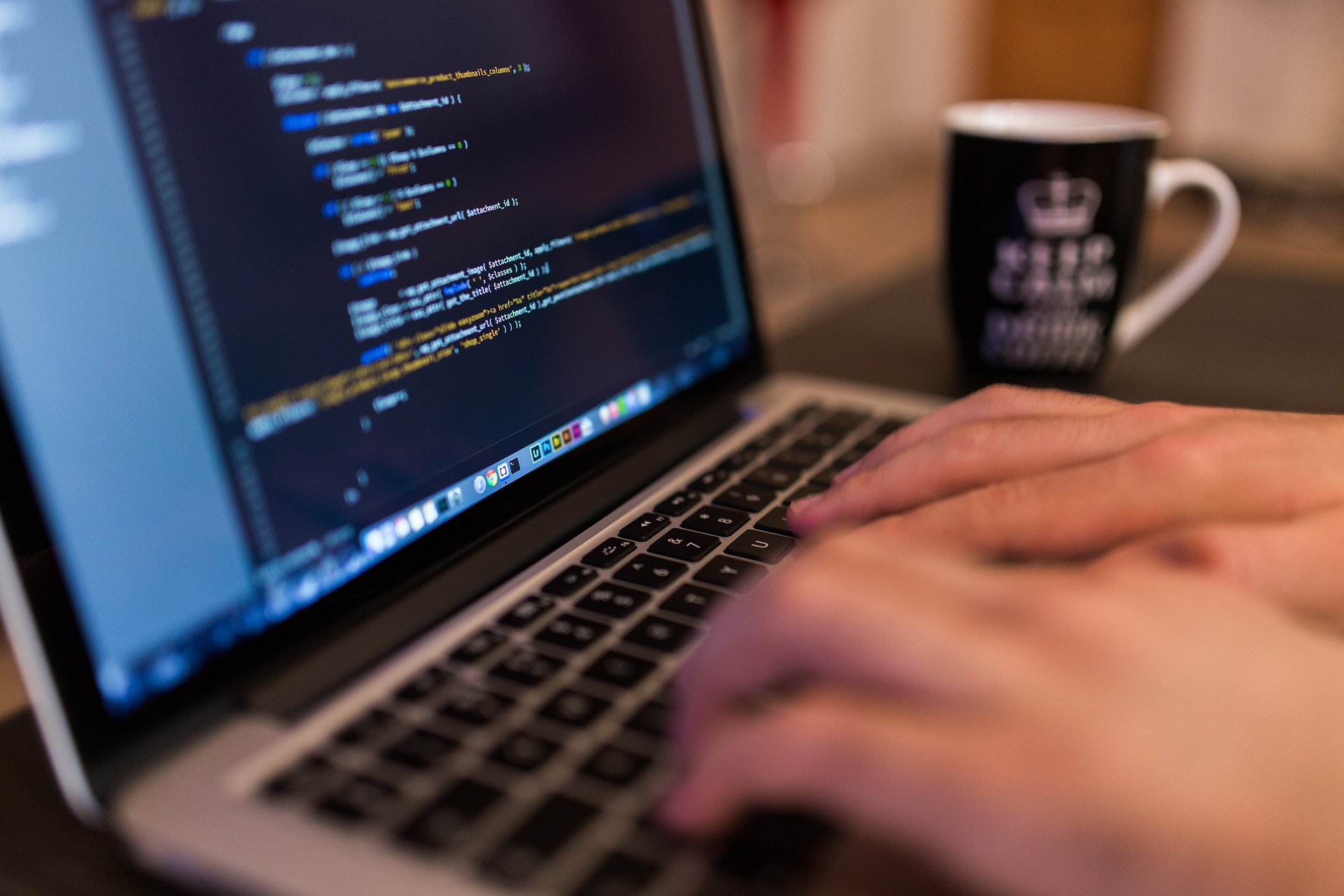 engineer programming on a laptop